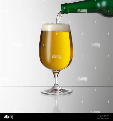 Pouring Beer Into Glass Stock Photo Alamy