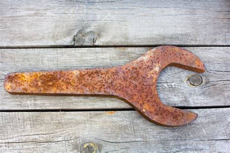 Huge Rusty Old Wrench On A Wooden Background Stock Image Image Of