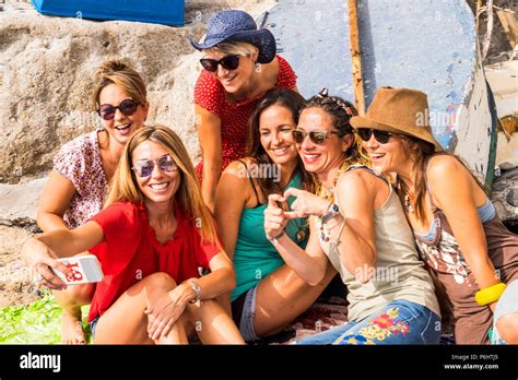 Group Of Beautiful Young Females Friends Having Fun Together Outdoor In Leisure Activity Doing A