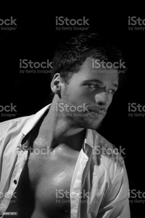 Black And White Portrait Of Young Attractive Man In Unbuttoned Creased