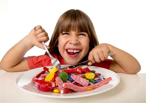 Child Eating Candy Like Crazy In Sugar Abuse And Unhealthy Sweet