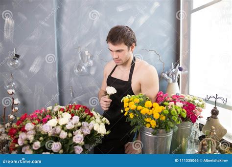 Image Of Thoughtful Florist Wearing Black Apron On Naked Body Among