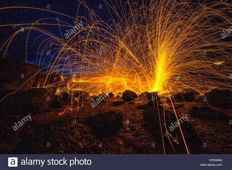 Cool Burning Steel Wool Fire Work Photo Experiments On The Rock At