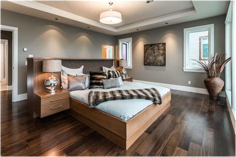 It's beautiful, with the blue and white bedding, teal walls with white trim, dark wood nightstands with lamps and beige area rug. Pin on Home remodel ideas