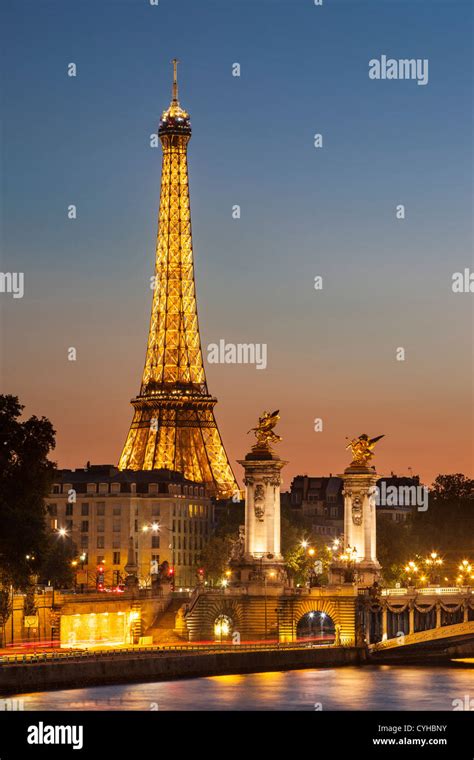 Dusk Over The Eiffel Tower And River Seine Paris France Stock Photo
