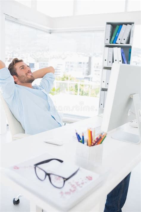 Casual Man Resting With Hands Behind Head In Office Stock Image Image