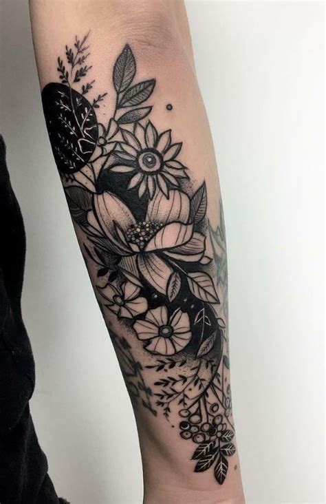 A Womans Arm With Flowers And Leaves On The Inside Of Her Forearm Tattoo