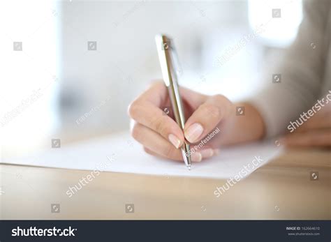 Closeup Womans Hand Writing On Paper Stock Photo 162664610 Shutterstock