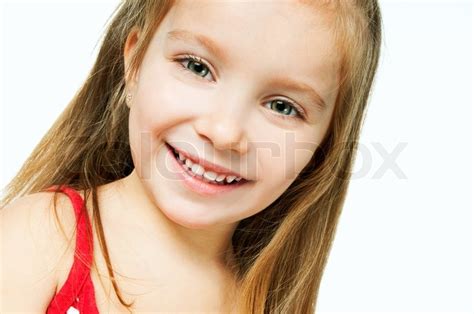 Beautiful Little Girl Smiling On A White Background Stock Photo