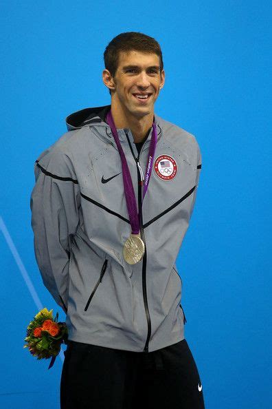 Taking the prestigious place on sport ilustrated magazine, record breaking swimmer michael phelps poses along with all 28 of the olympic medals he has won across his career. London 2012 Michael Phelps- Team USA Silver Medalist Men's ...