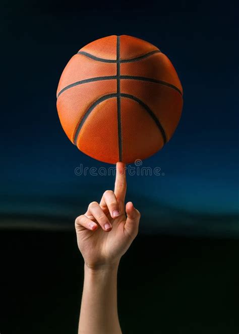 Close Up Of Professional Basketball Player Spinning A Ball On Hand