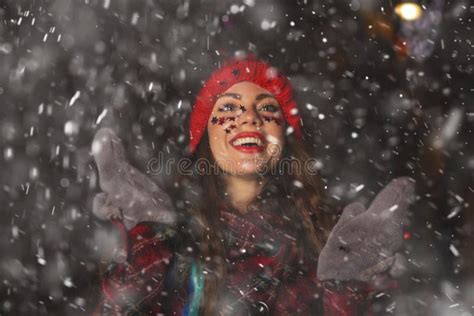 Beautiful Lady Enjoying Snowy Weather At The Holiday Fair Stock Image