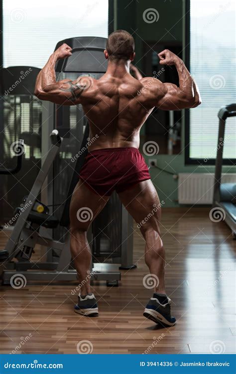 Bodybuilder Performing Rear Double Biceps Pose Stock Photo Image Of