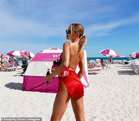 Kimberley Garner Poses In A Ripped Slinky Minidress As She Soaks Up The Sun On Miami Beach