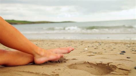 Womans Legs Sitting On The Beach Stock Footage Video Of Woman Person