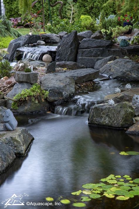Gorgeous Waterfall And Ecosystem Pond At A Residential Home Aquascape
