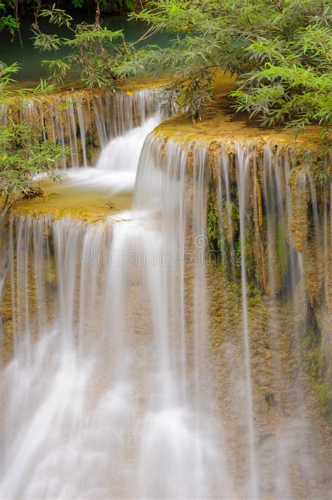 Beautiful Cascade Falls Over Mossy Rocks In Rainforest Thailand Stock
