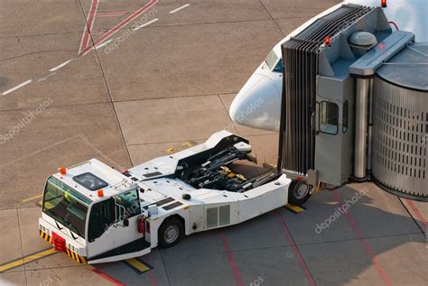 Airport Jet And Towing Truck — Stock Photo © Saasemen 2327400