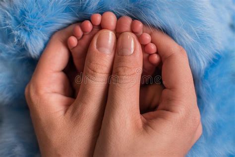 Parent Holding In The Hands Feet Of Newborn Baby Stock Image Image Of