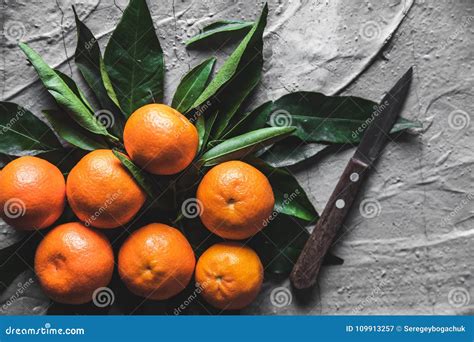 Citrus On Table Mandarin Tangerine With A Knife Fresh Organic Juicy