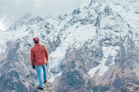 Young Guy Standing On Mountain Peak Stock Image Colourbox
