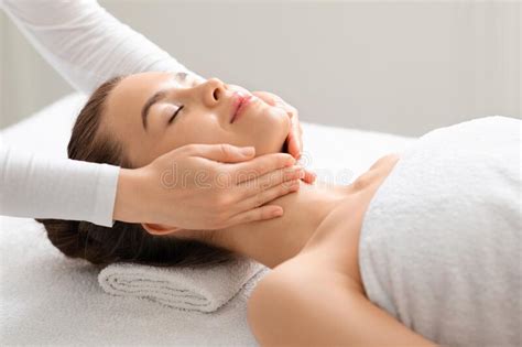 Joyful Young Woman Relaxing During Face Lifting Massage Stock Image Image Of Lifestyle Luxury