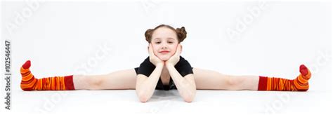 Babe Girl In Black Dress Doing Gymnastic Split On White Backgr Stock