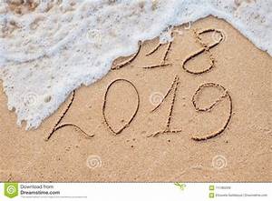 New Year 2019 Is Coming Concept Inscription 2018 And 2019 On A Beach
