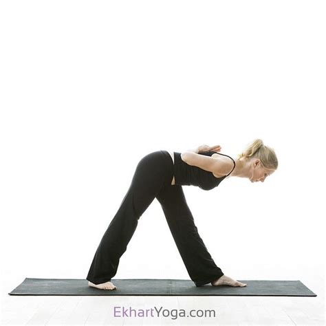 A Woman Is Doing Yoga On A Mat