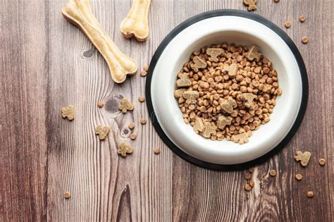 A Bowl Of Dog Food On A Wooden Floor Stock Image Image Of Healthy