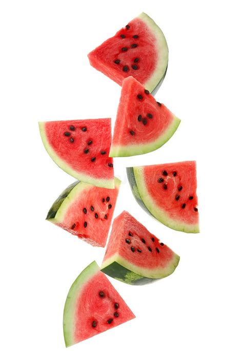 Slices Of Delicious Ripe Watermelon Falling On White Background Stock