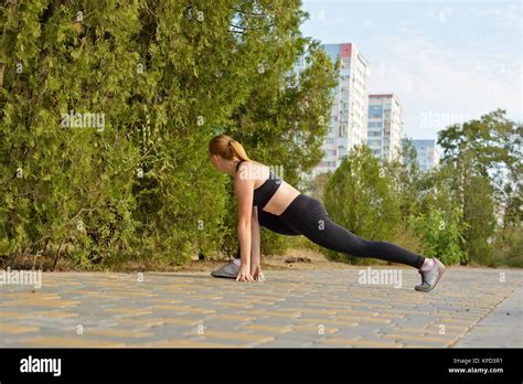 Girl Wearing Sportswear And Doing Stretching Exercises Outdoor Fitness Fashion Workout