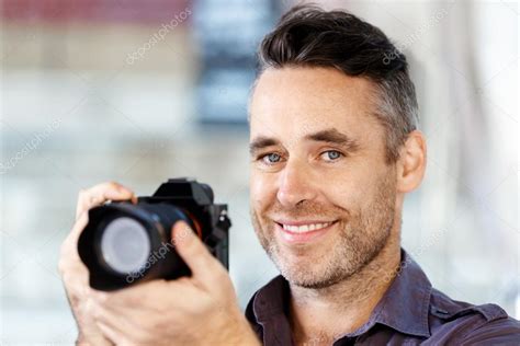 Male Photographer Taking Picture Stock Photo By ©sergeynivens 123612402