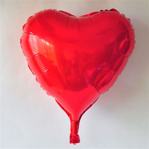 Heart Shape Balloon In Red Color As An Added T