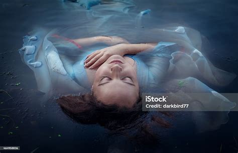 Young Beautiful Drowned Woman Lying In The Water Stock Photo Download