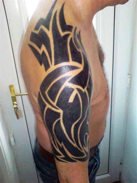 30 Groovy Tribal Arm Tattoos Slodive
