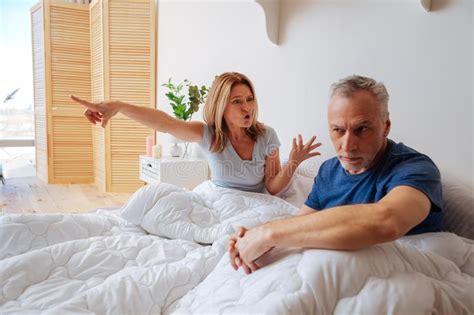 Emotional Woman Yelling At Her Husband After Betrayal Stock Image