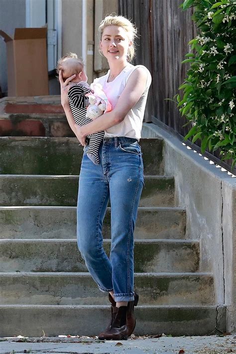 My baby is a.357 magnum. Amber Heard cradled her friend's baby while visiting her ...
