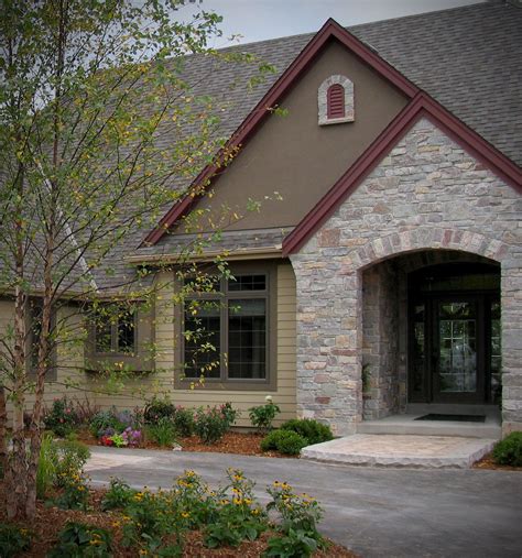 Refined rustic ranch house cabin creek river rock veneer stone design