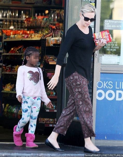 Is Charlize Therons Adopted Son Becoming A Girl He Wears Box Braids And Pink Outfit