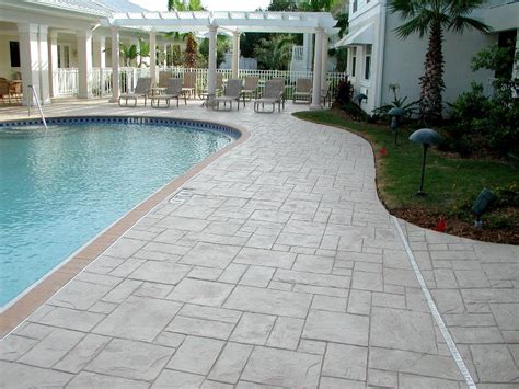 One idea is to add color to the concrete. Stamped Concrete Pool Deck