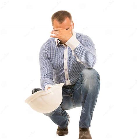 Crouching Man With Hard Hat With Head In Hand Stock Image Image Of Builder Confident 44774135