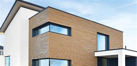 Fassade: Holzprofile und HPL-Platten von Mühlschlegel in ...