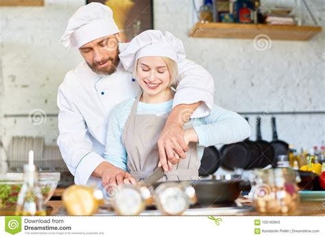 Teamwork Of Professional Chef And Young Assistant Stock Image Image