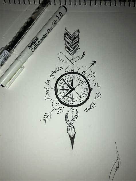 A Drawing Of A Compass And Arrows With Writing On Paper Next To A