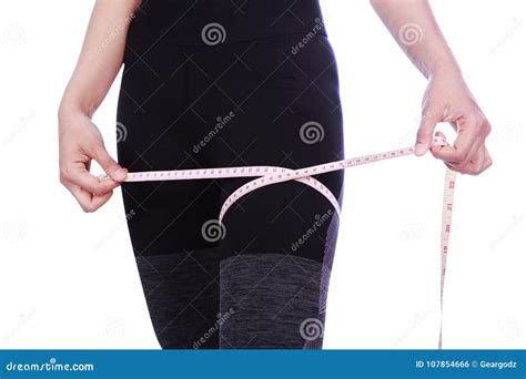 Close Up Woman Is Measuring Her Thigh With Measure Tape Isolated Stock