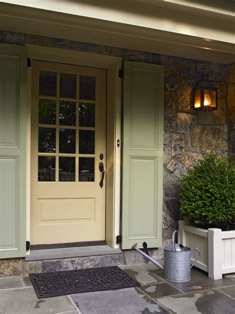 Everything from their shape, to their color, to the doorknocker hanging on the front can give visitors an immediate impression. Front Door Shutters Farmhouse with Marvin Door | Cottage exterior, House exterior, Exterior ...