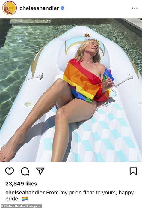 Chelsea Handler Reclines Naked On Pool Inflatable Wrapped In Rainbow Flag To Celebrate Pride