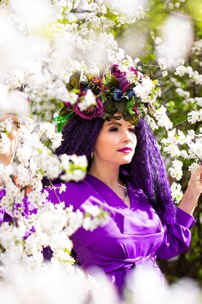 Premium Photo Beautiful Young Lady In The Garden Of Cherry Blossoms