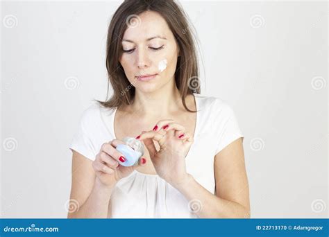 Woman Putting Lotion On Stock Photo Image Of Cream Skin